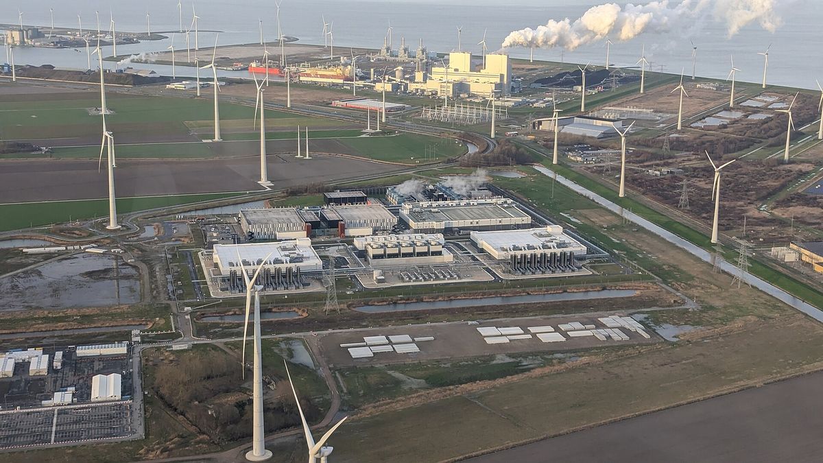 Aerial view of a Google data center at Eemshaven in the Netherlands surrounded by wind turbines