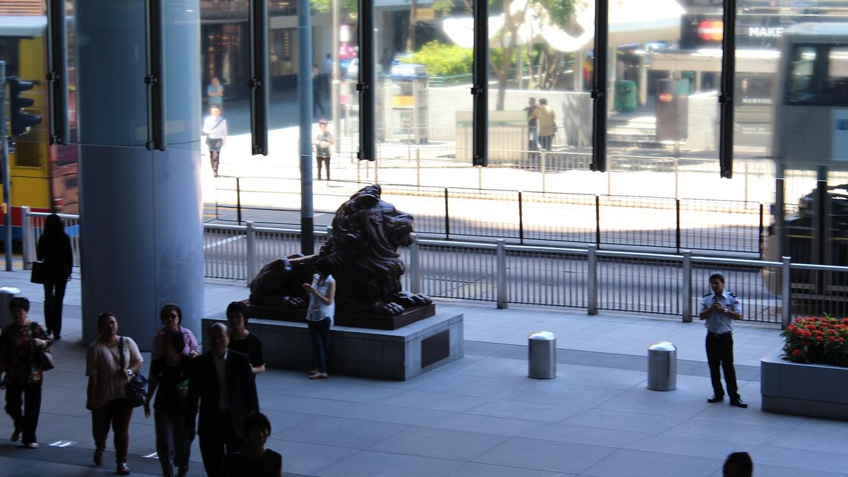 The plaza beneath HSBC's Hong Kong headquarters in Central with one of its bronze lion statues