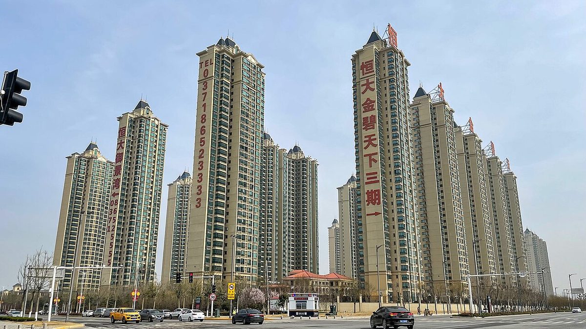 High-rise residential towers built by China Evergrande along a wide road in Henan province, China